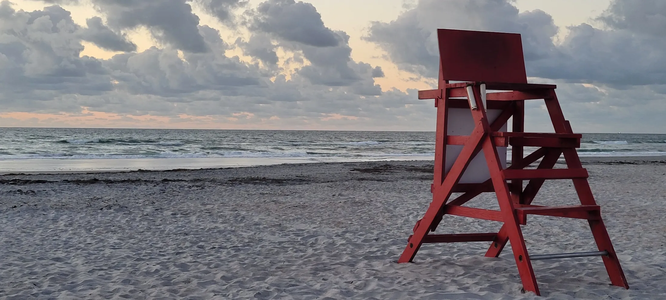 Red lifeguard stand on St. Augustine Beach at sunrise